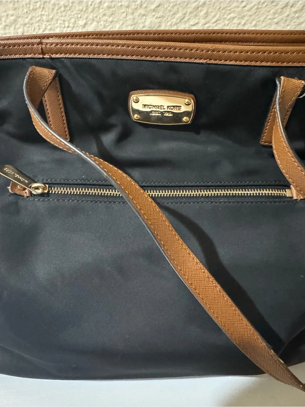 Michael Kors Black Tote with Brown Trim and Gold Plate